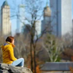 A New Yorker with depression and anxiety sitting in central park